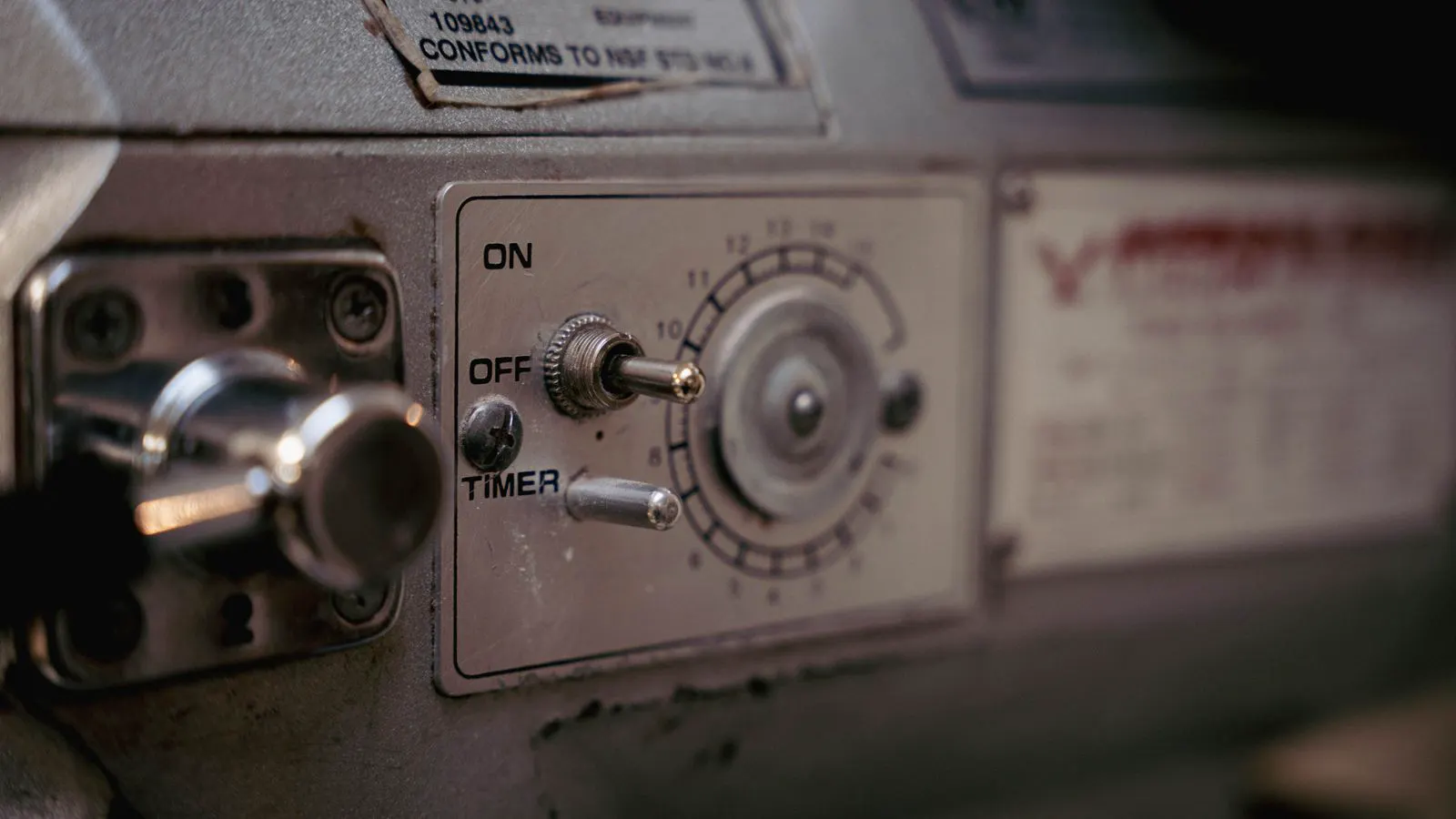 Close view of an injection molding machine control screen showing active process data