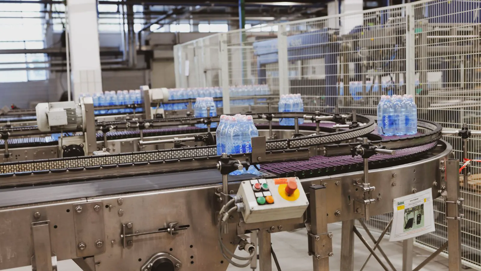 A robotic arm with an optical sensor scanning molded plastic parts