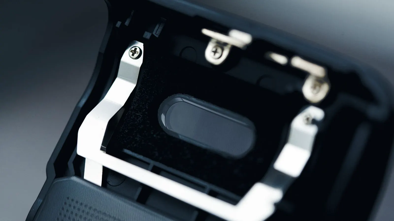 A plastic molded part showing a visible sink mark on its surface