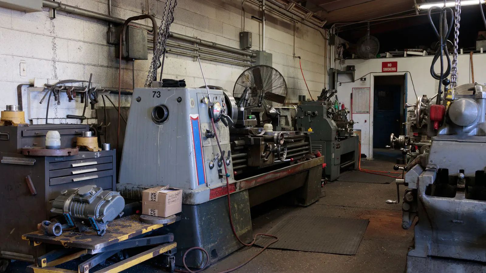 Technicians inspecting a new injection mold in a plant