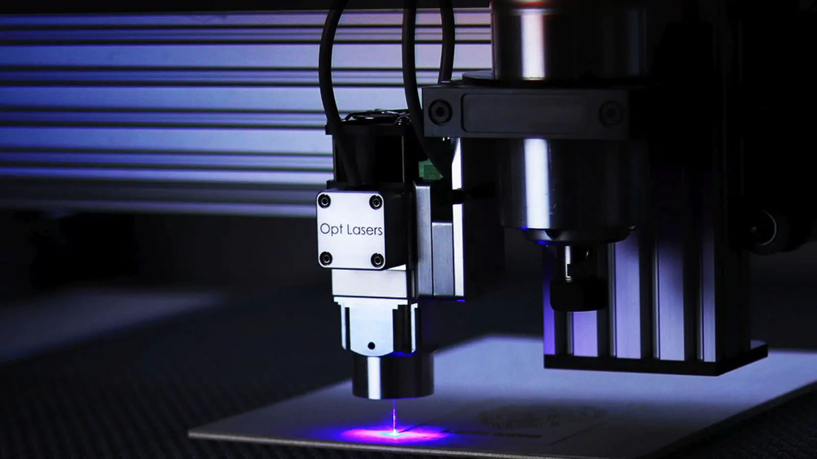 A CNC machine cutting a precision steel mold blank