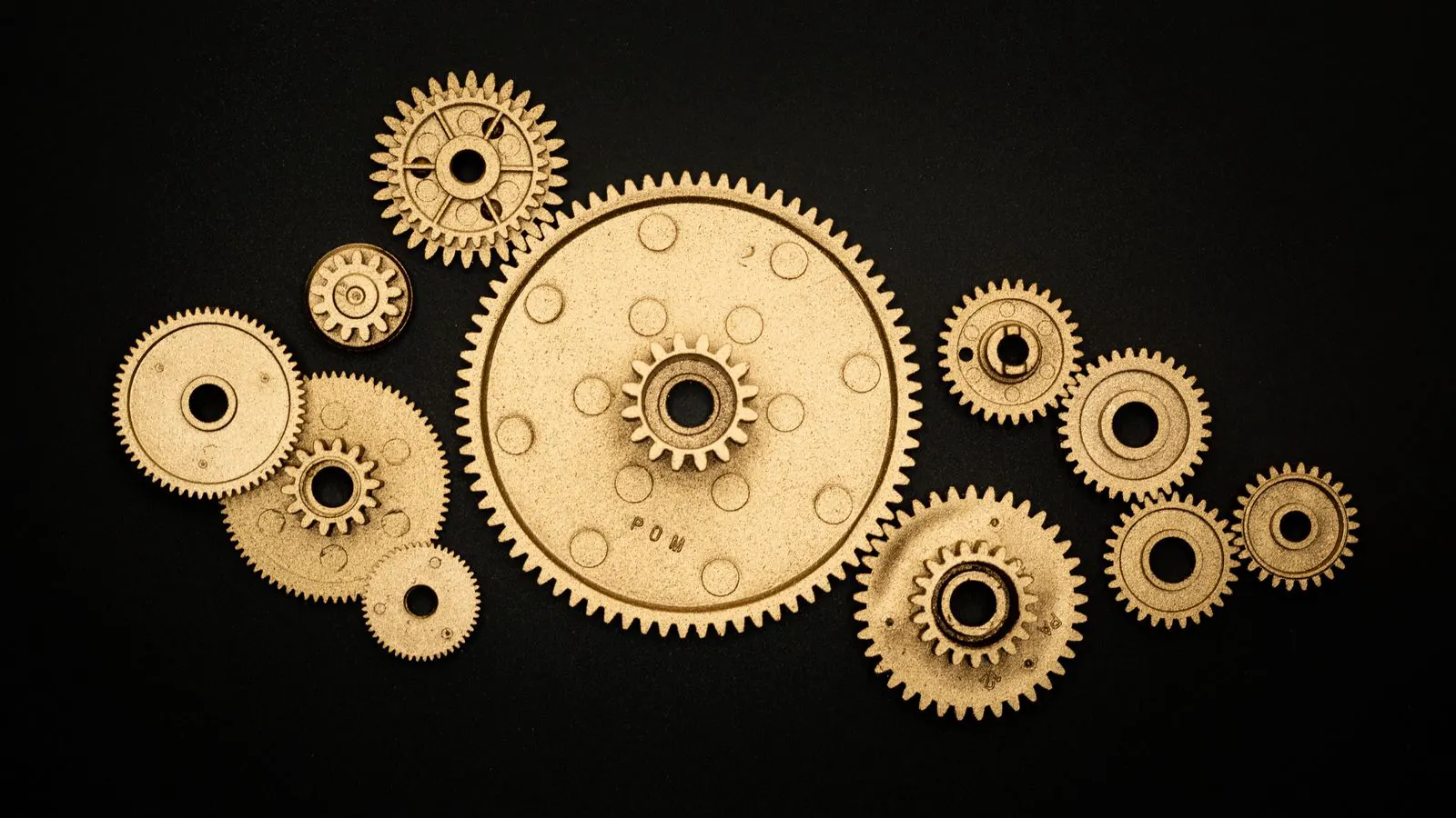 Close-up view of precision injection molded plastic gears in a factory setting