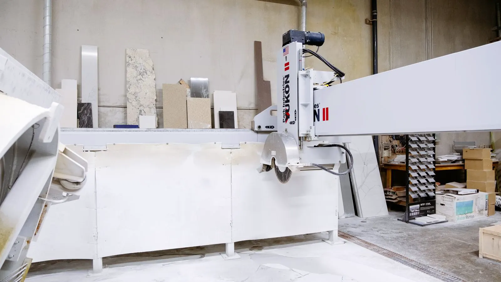 A factory floor with multiple cutting machines ready for mixed material jobs.