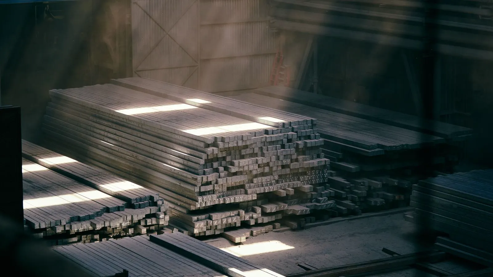 Inspector checking sheet metal parts on a rack