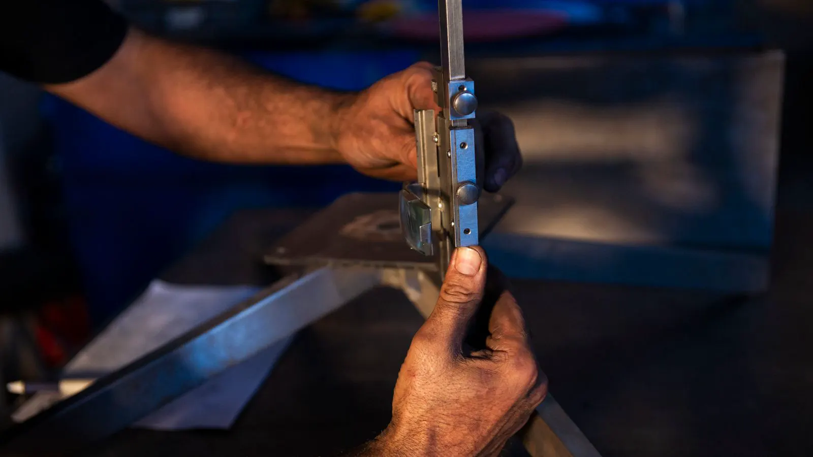 A metal fabrication shop with cut panels and tools