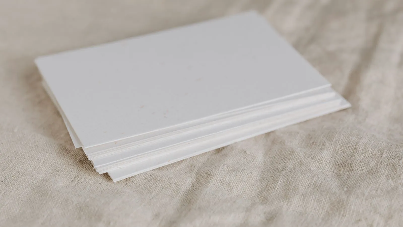 Stack of sheet steel sheets next to a printed mill certificate