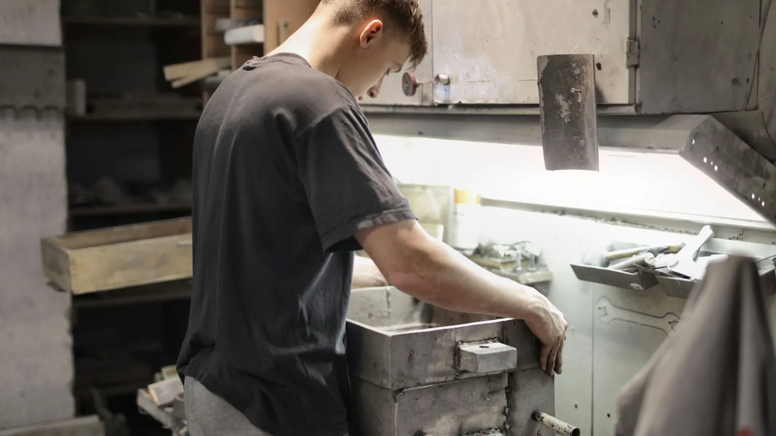 Close up of a CNC machine cutting a die cast aluminum component