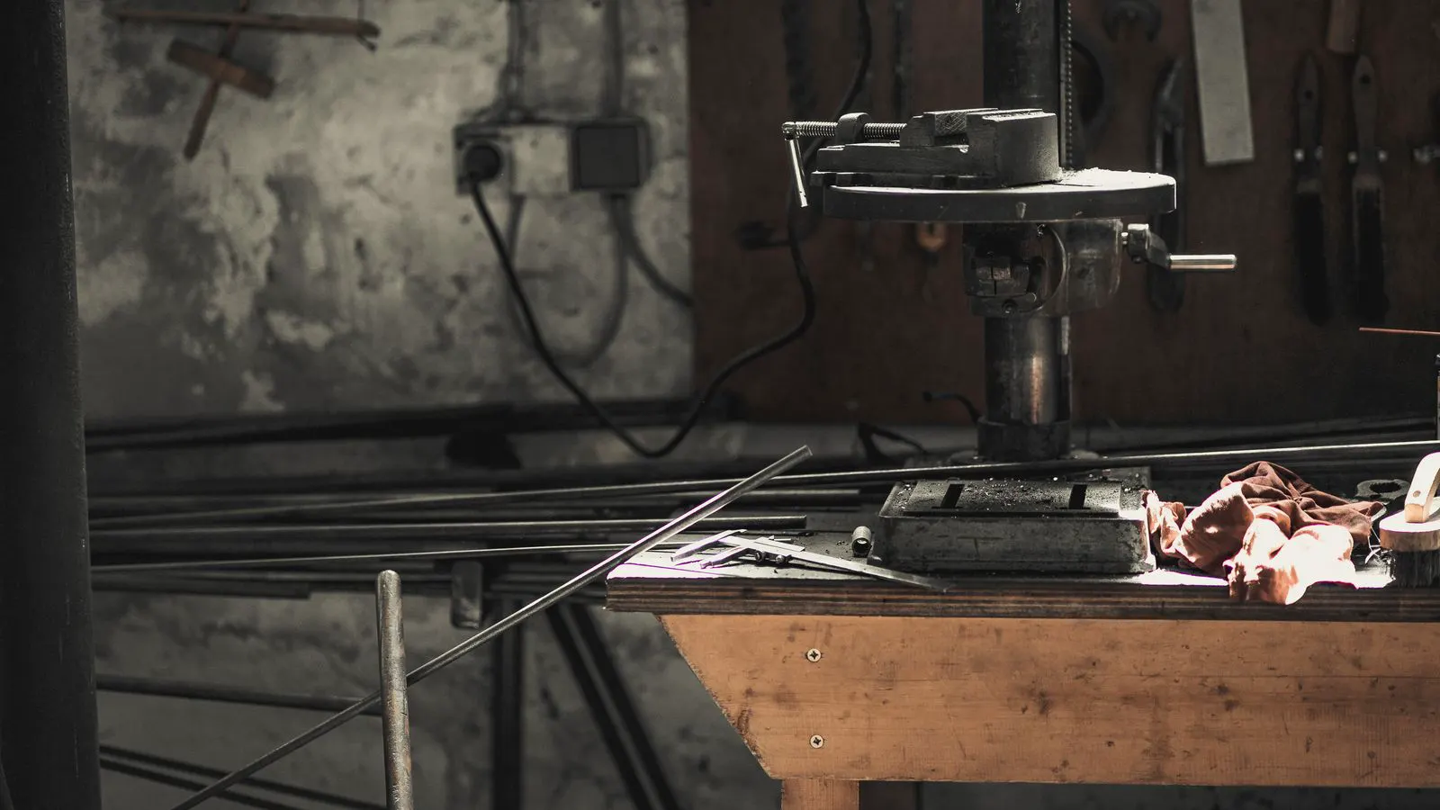A stack of polished steel die blocks on a factory workbench.