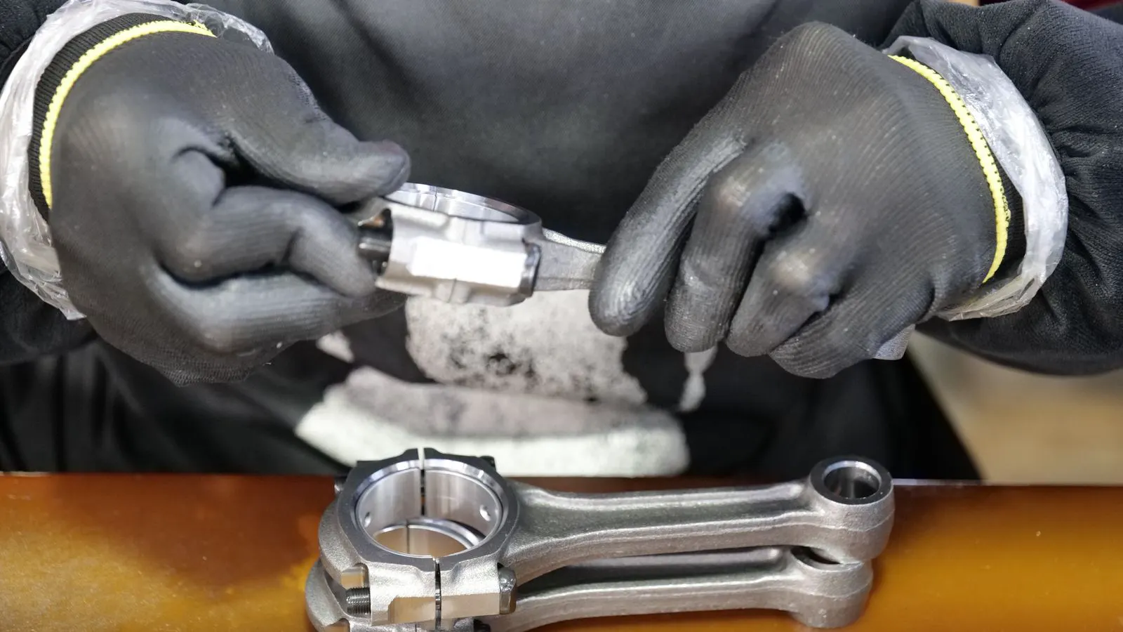 Close up view of metal casting machine with metal parts