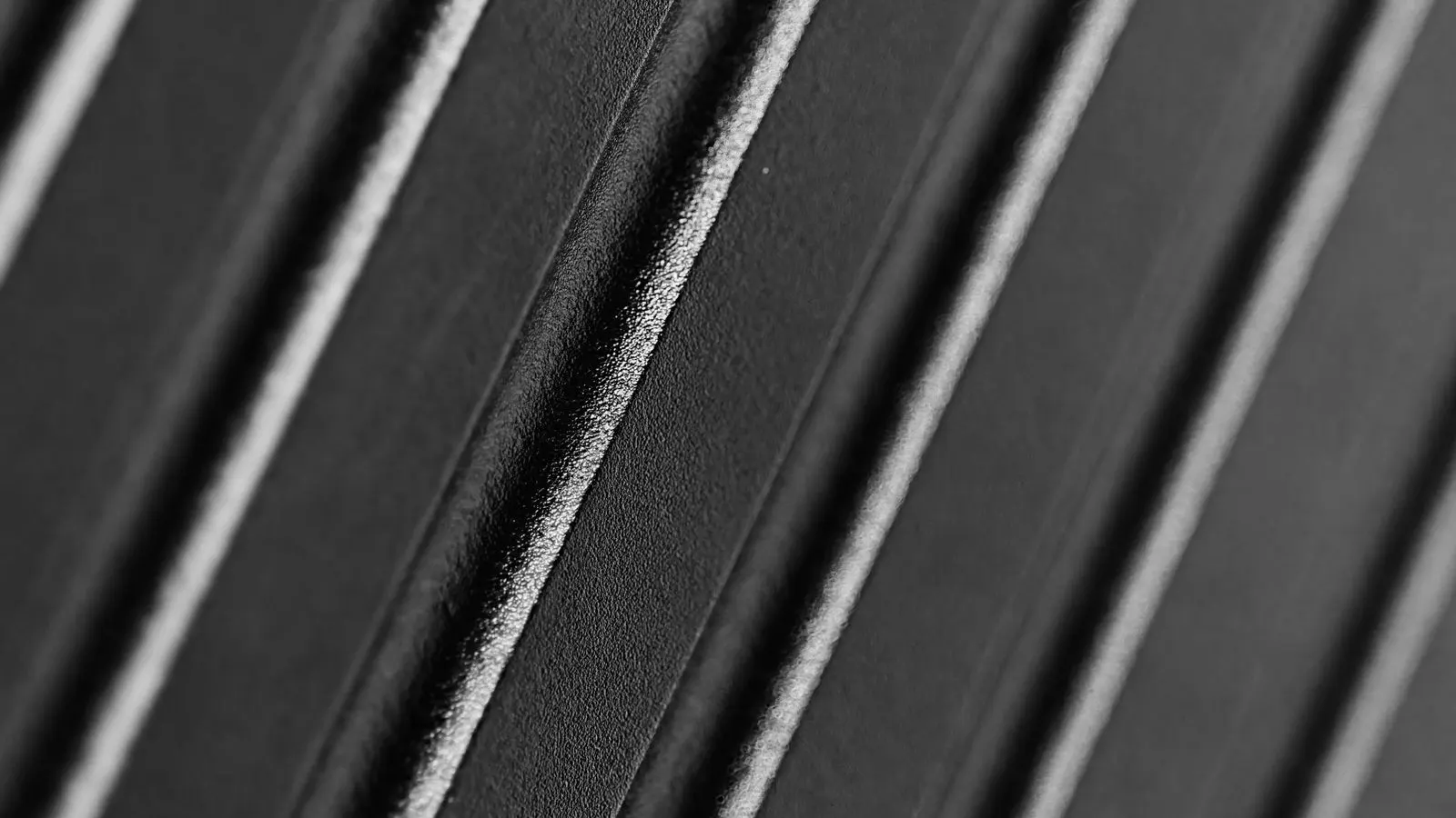 Close-up of a die cast aluminum part showing surface texture detail.