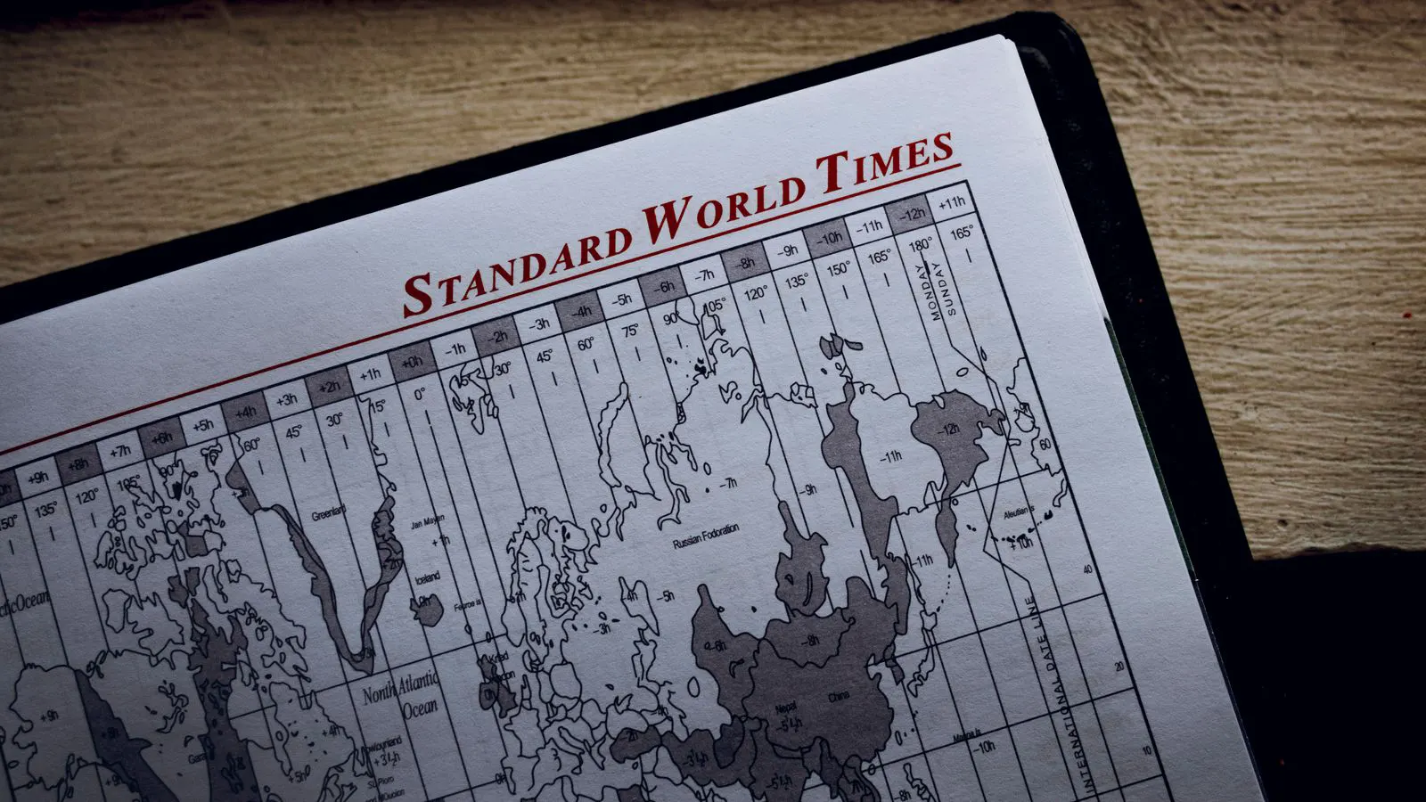 A factory engineer checks a production calendar with a tablet.