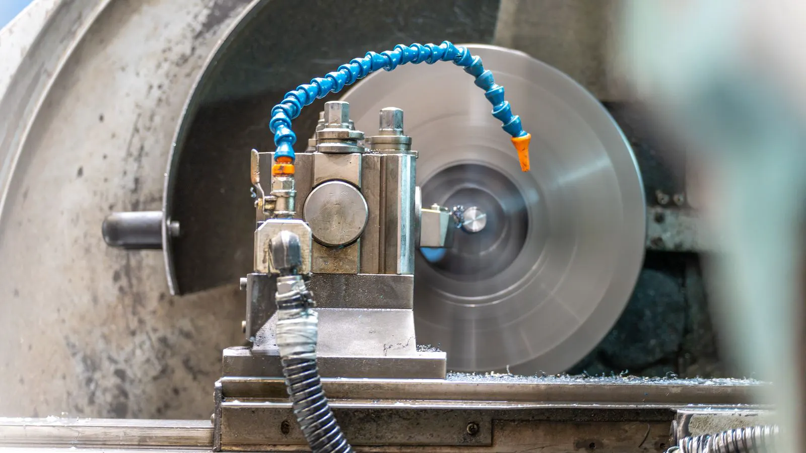 A CNC machine removing metal shavings from a die cast part