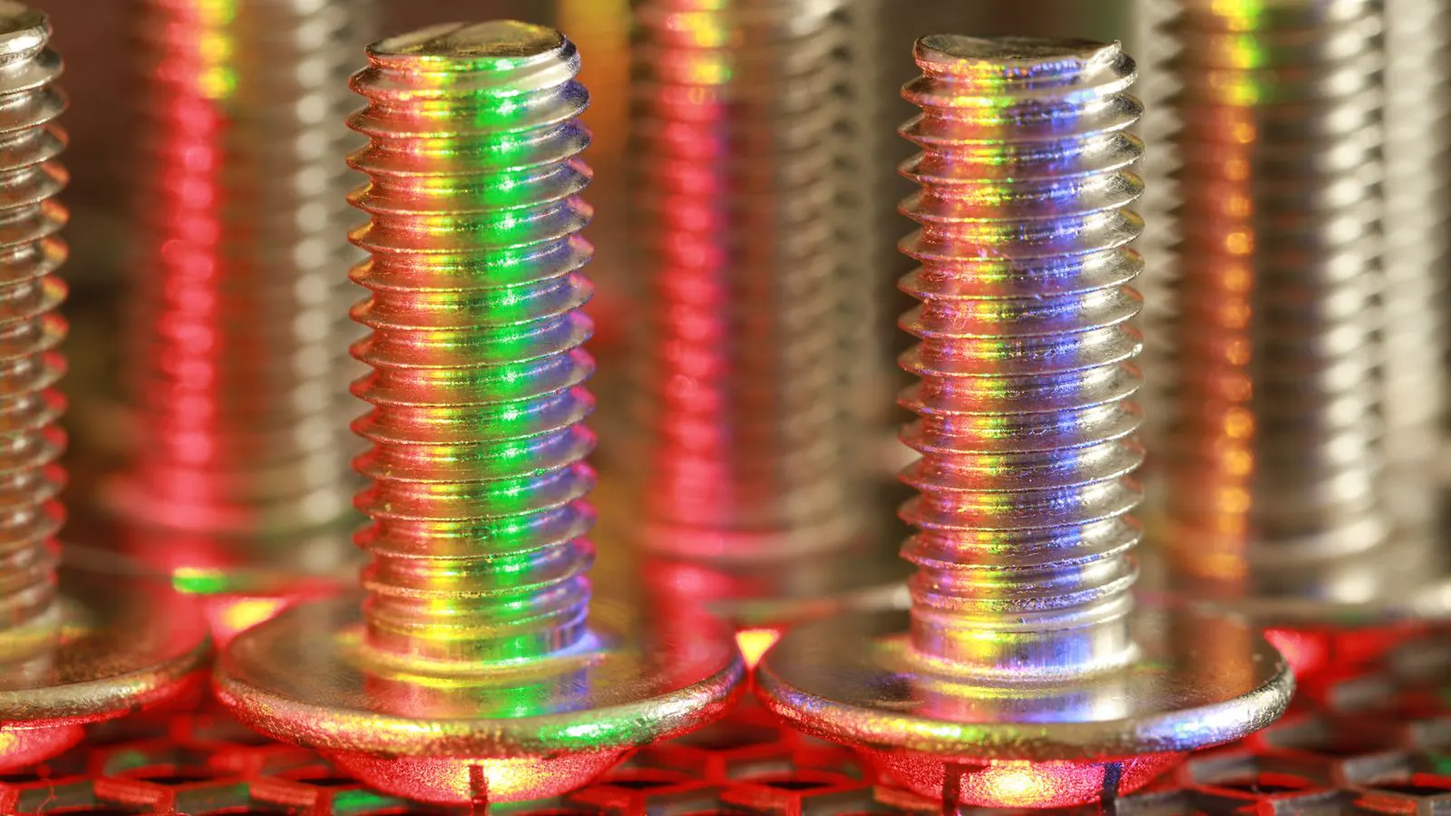 A sheet of stainless steel being formed into a curved medical component shape
