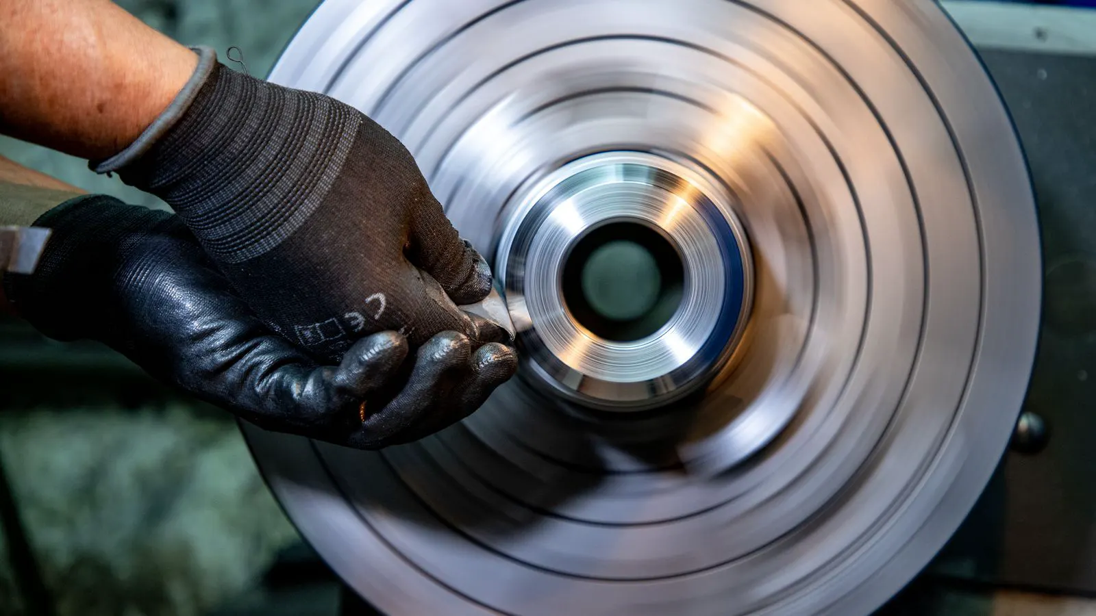 Close up of delicate stamped metal parts on a production line