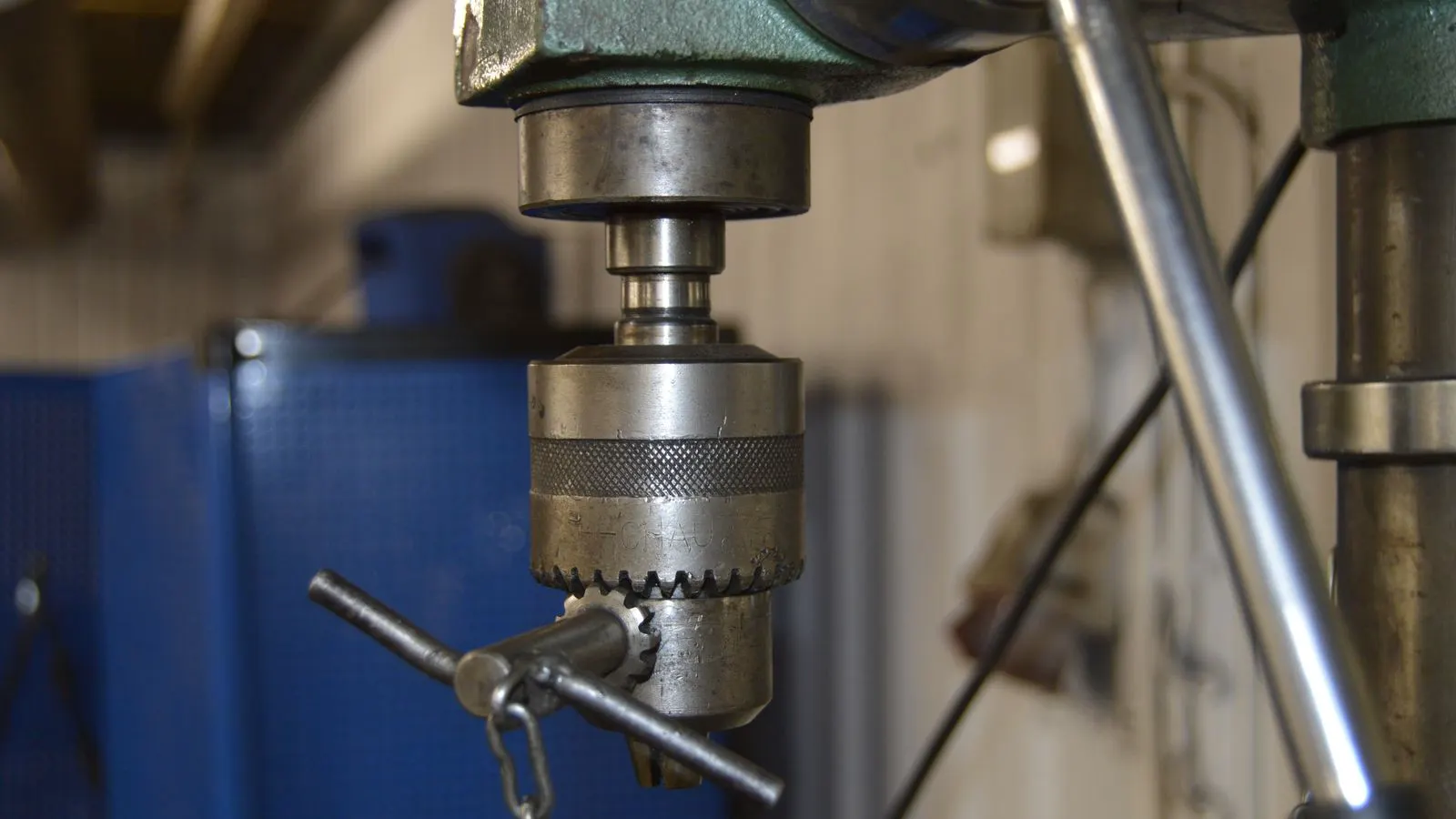 A large mechanical press performing a metal stamping operation in a factory.