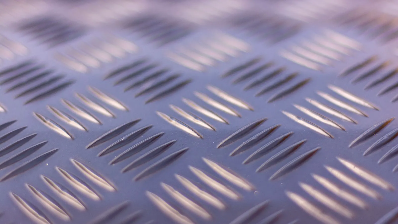 Coated steel sheet on a stamping press table