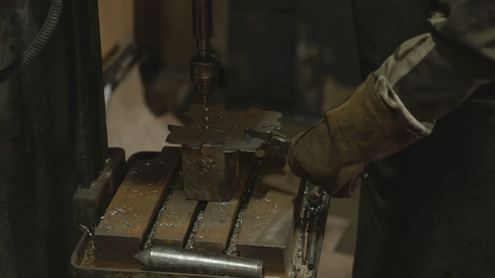 A large progressive die assembly installed inside a mechanical press