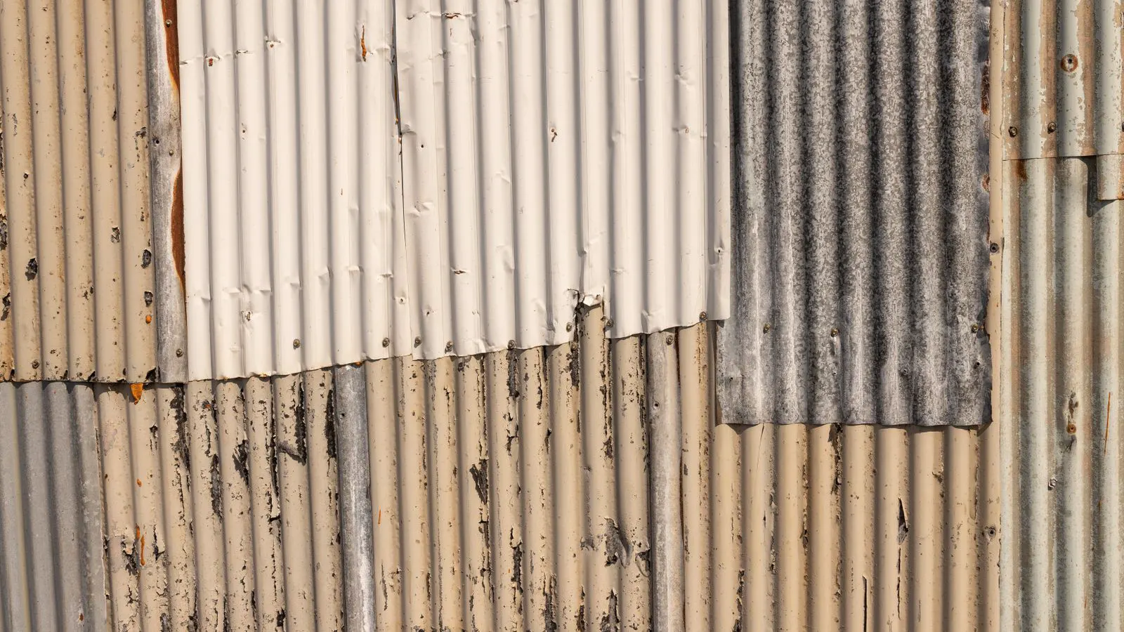 A flat sheet of steel with a visible zinc coating surface.