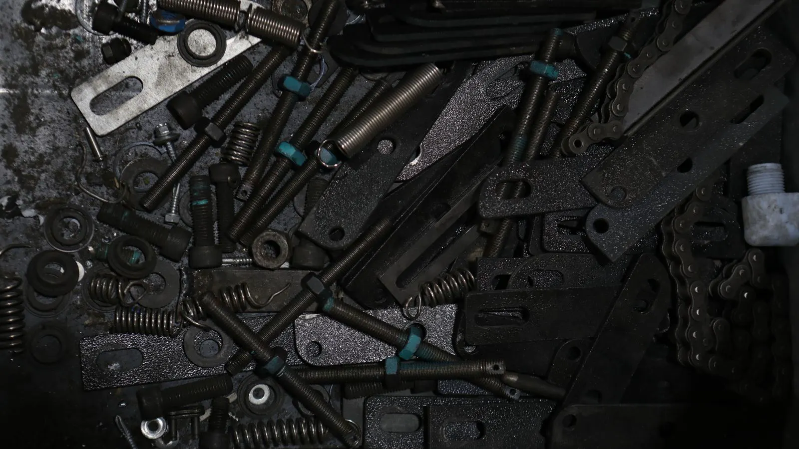 close-up of a progressive die set in a stamping press