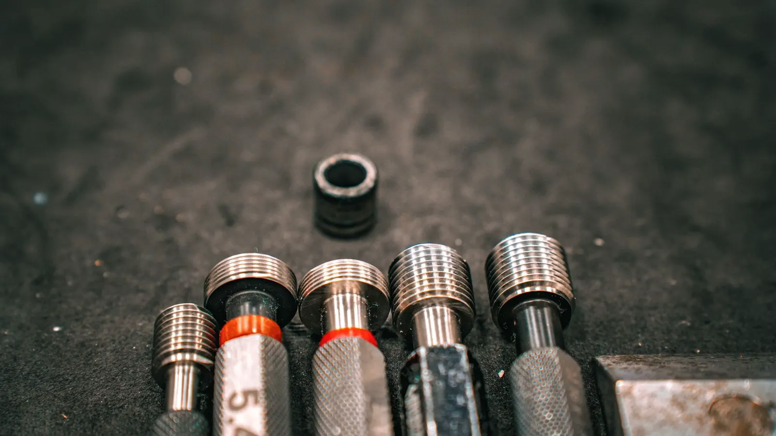 Metal stamping die tooling components on a workbench