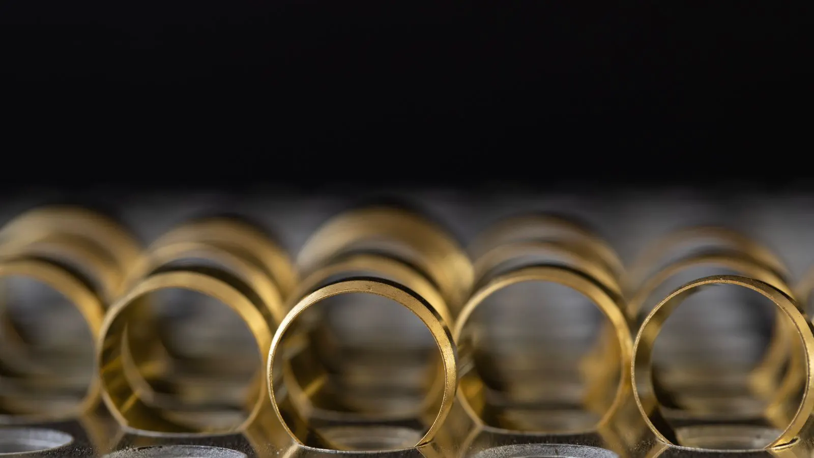 Close up of a metal press and stamped parts