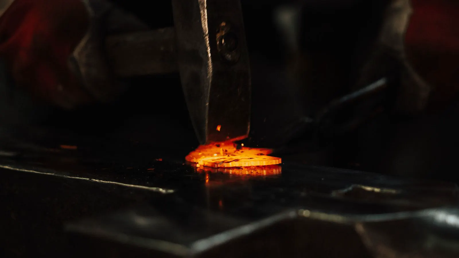 Close up of metal forging press shaping steel