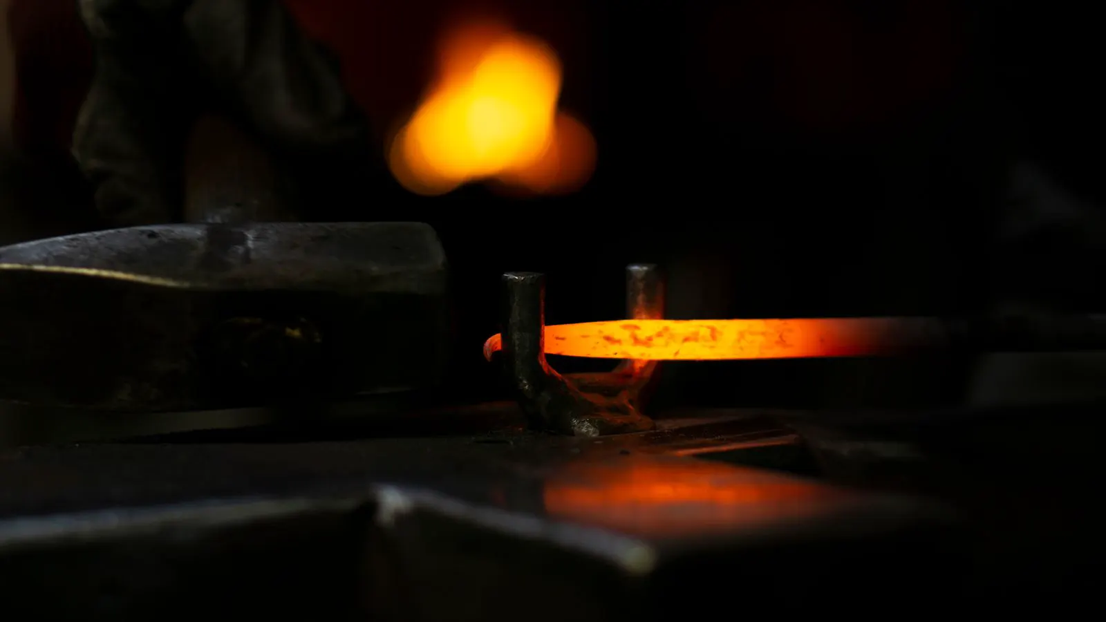 Forged steel components resting on a metal inspection table