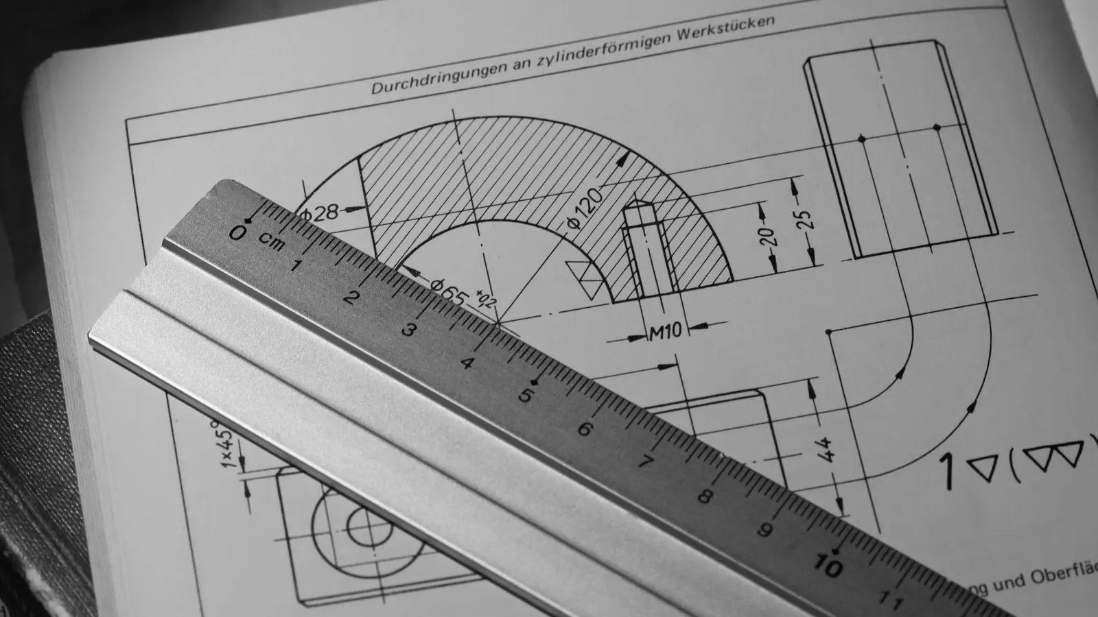 A close-up photograph of a machined forged metal component