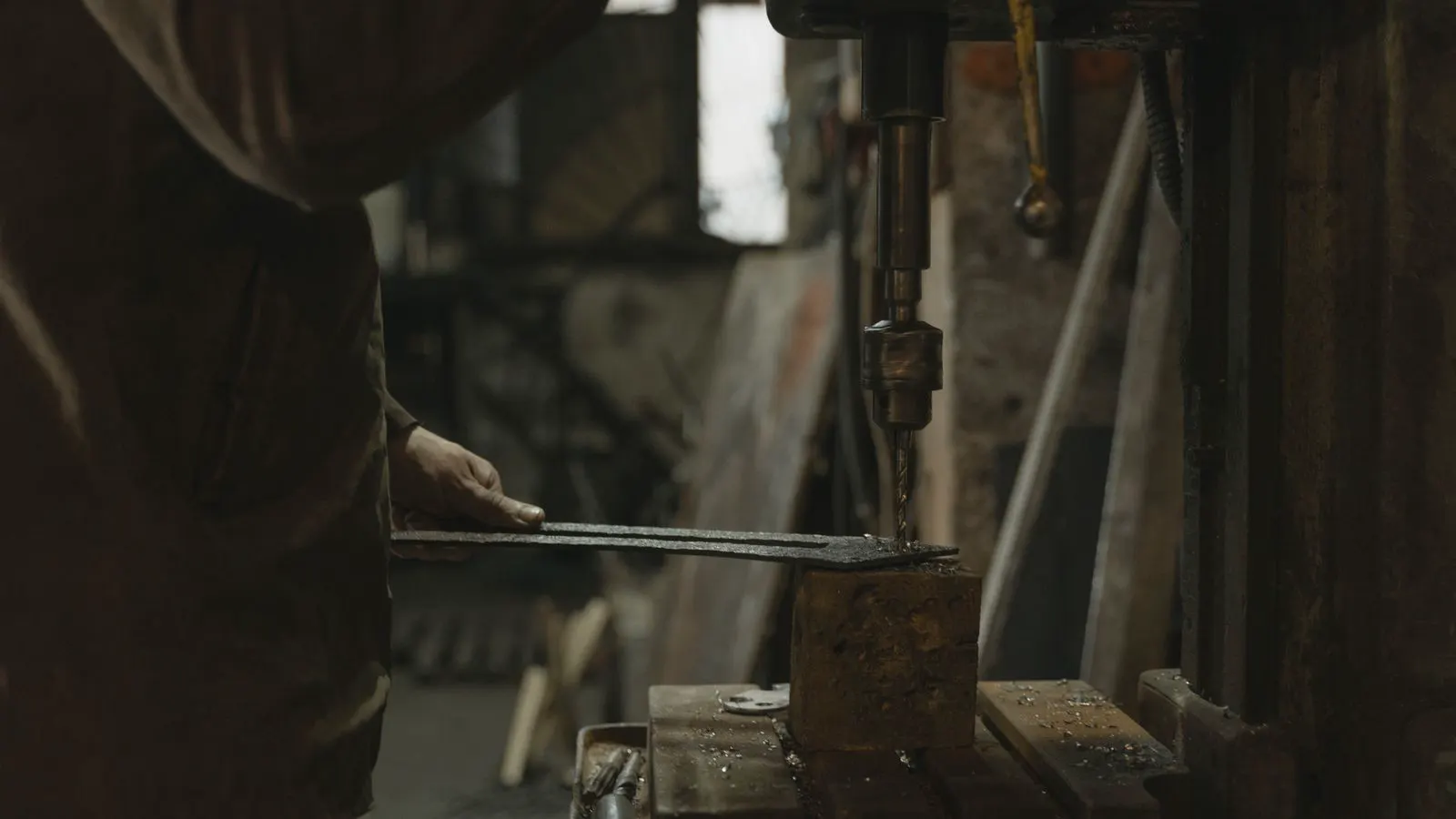 Industrial forging press shaping hot steel metal parts