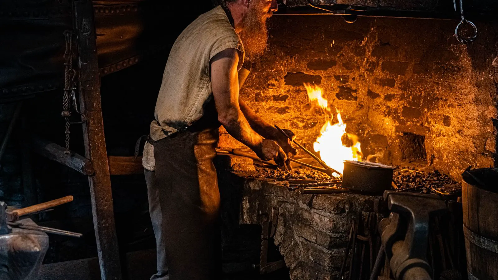 A forged steel part cooling inside an industrial heat treatment furnace.