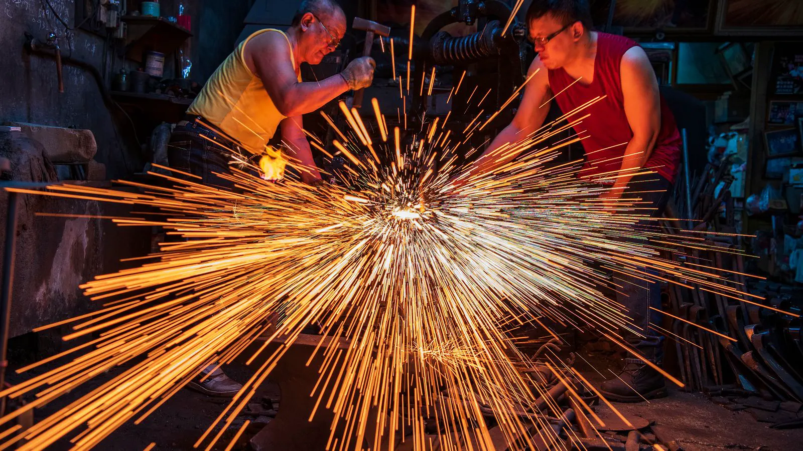 Industrial forging press shaping hot metal in a workshop