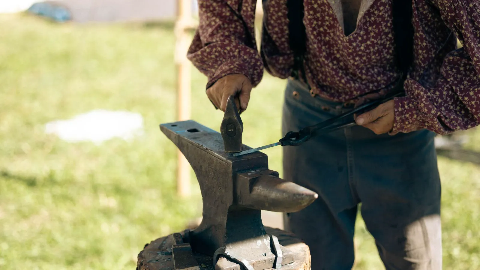 A close-up view of a heavy forging die block in a workshop