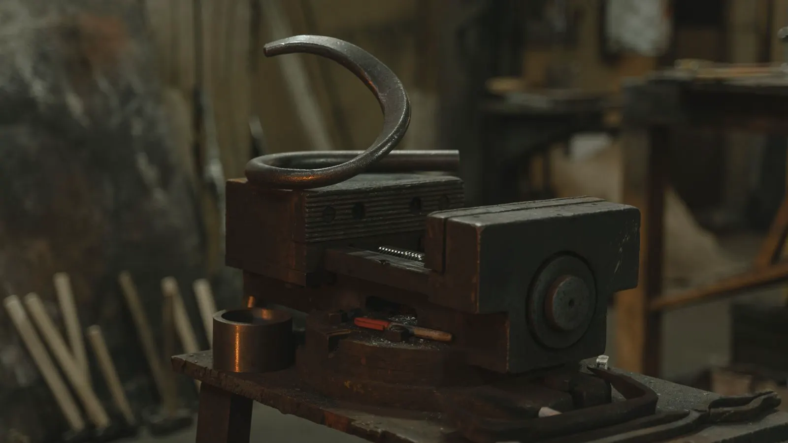 Hardness tester indenter pressing a forged alloy steel part surface