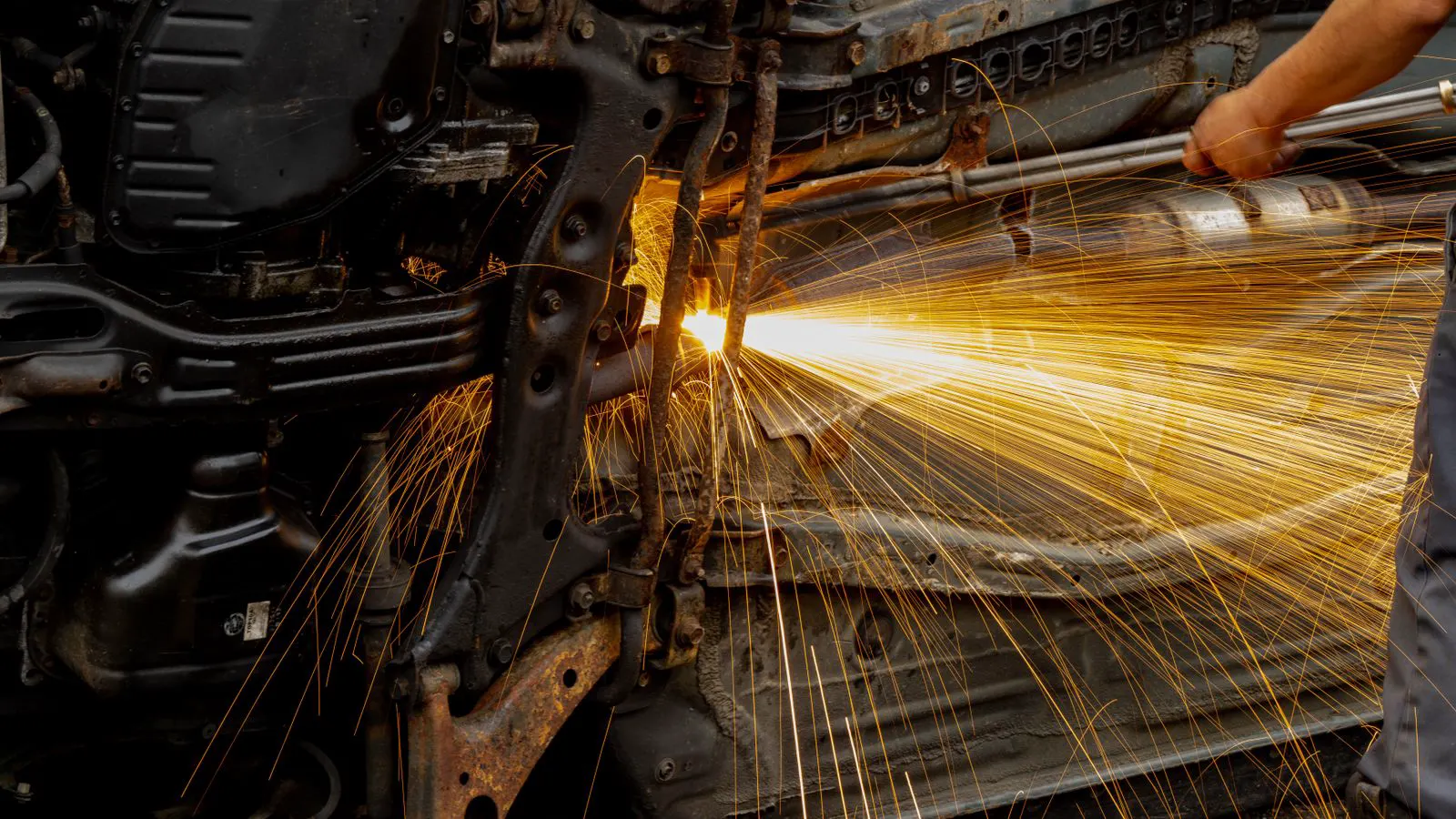 A heat treated forged alloy component resting on a workshop table