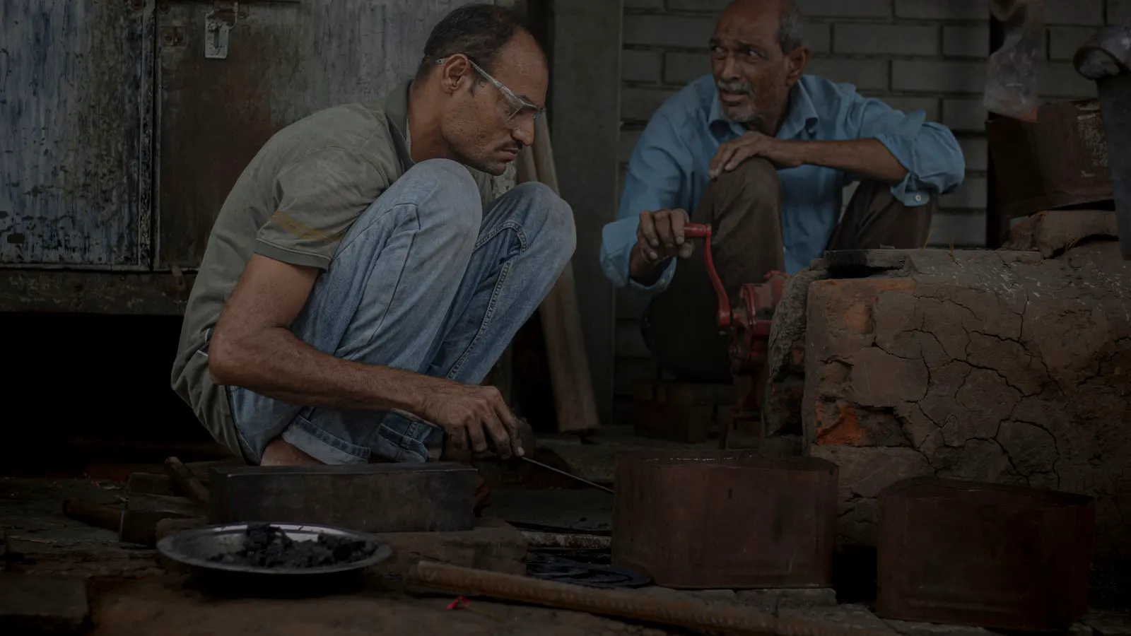 Technician uses an ultrasonic probe on a heavy forged steel component