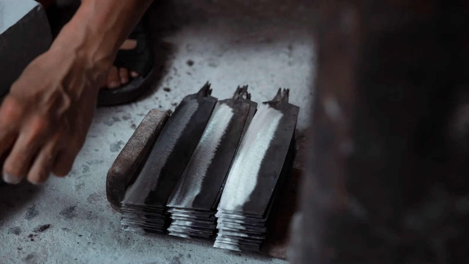 Furnace door open revealing glowing forged steel bar inside