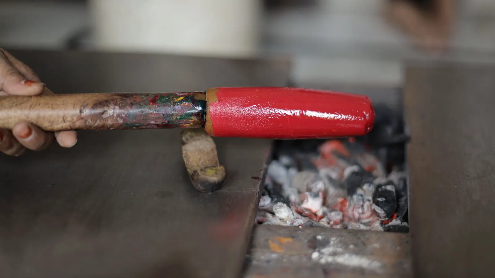 Industrial press shaping aluminum billet in a manufacturing plant