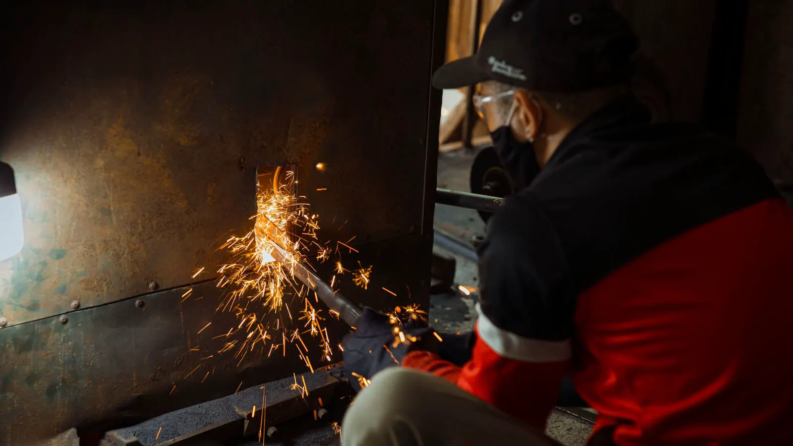 A large industrial furnace displaying heated metal components during a heat treatment process