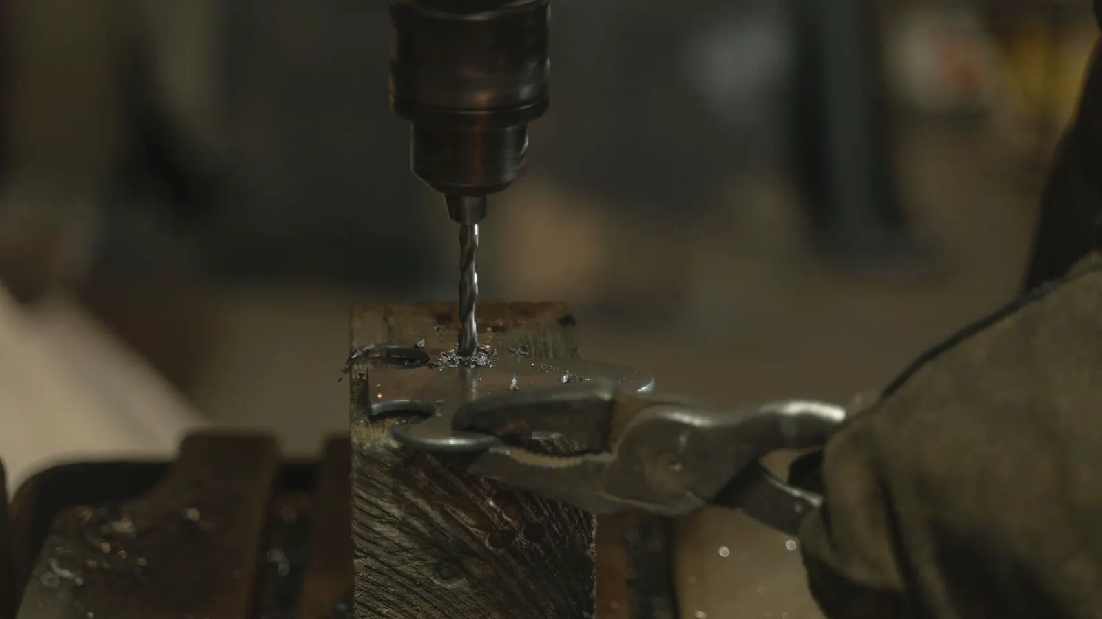 A hot metal billet entering a closed-die forging press.