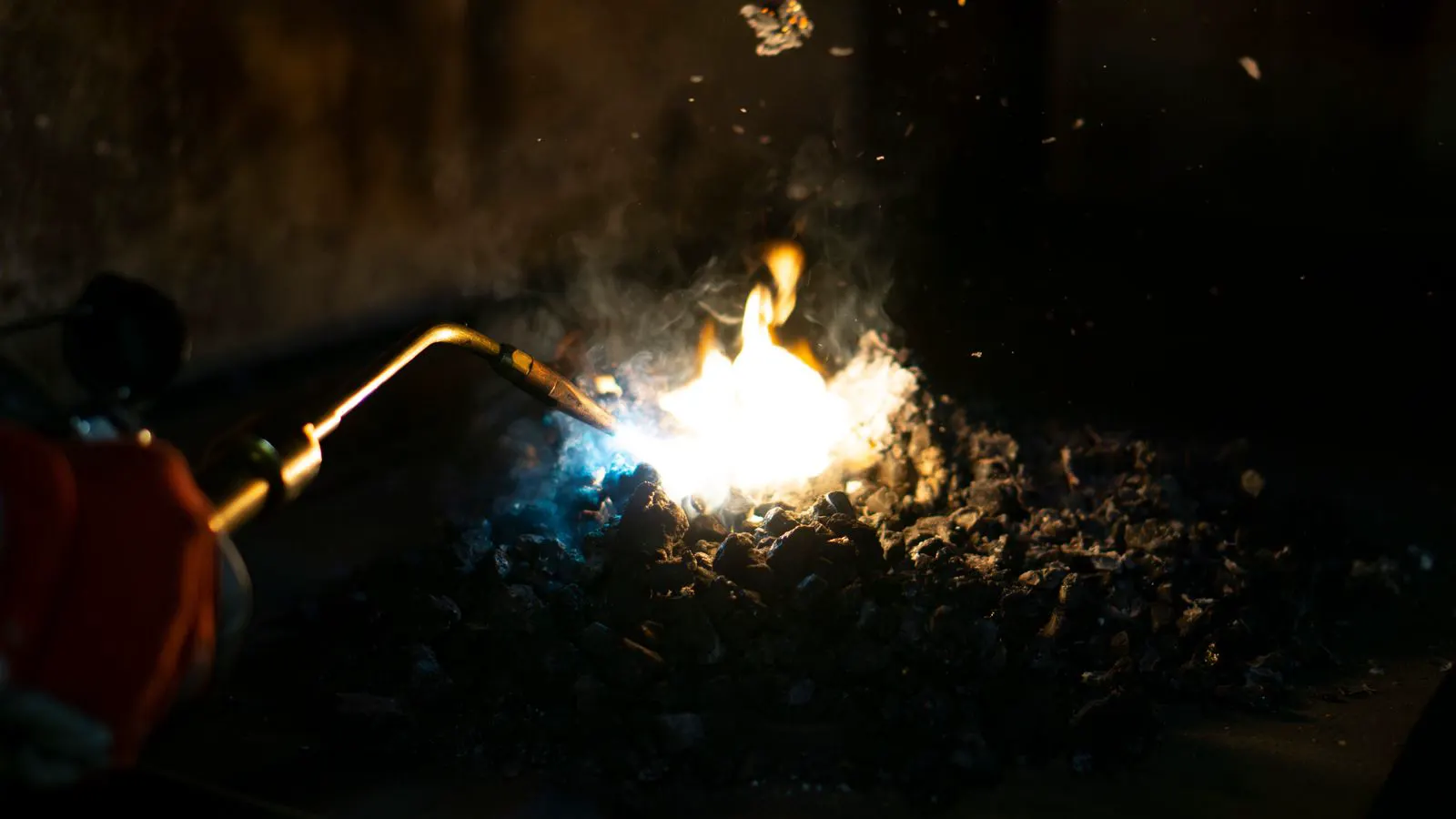 A machinist checking hardness on a forged alloy part.