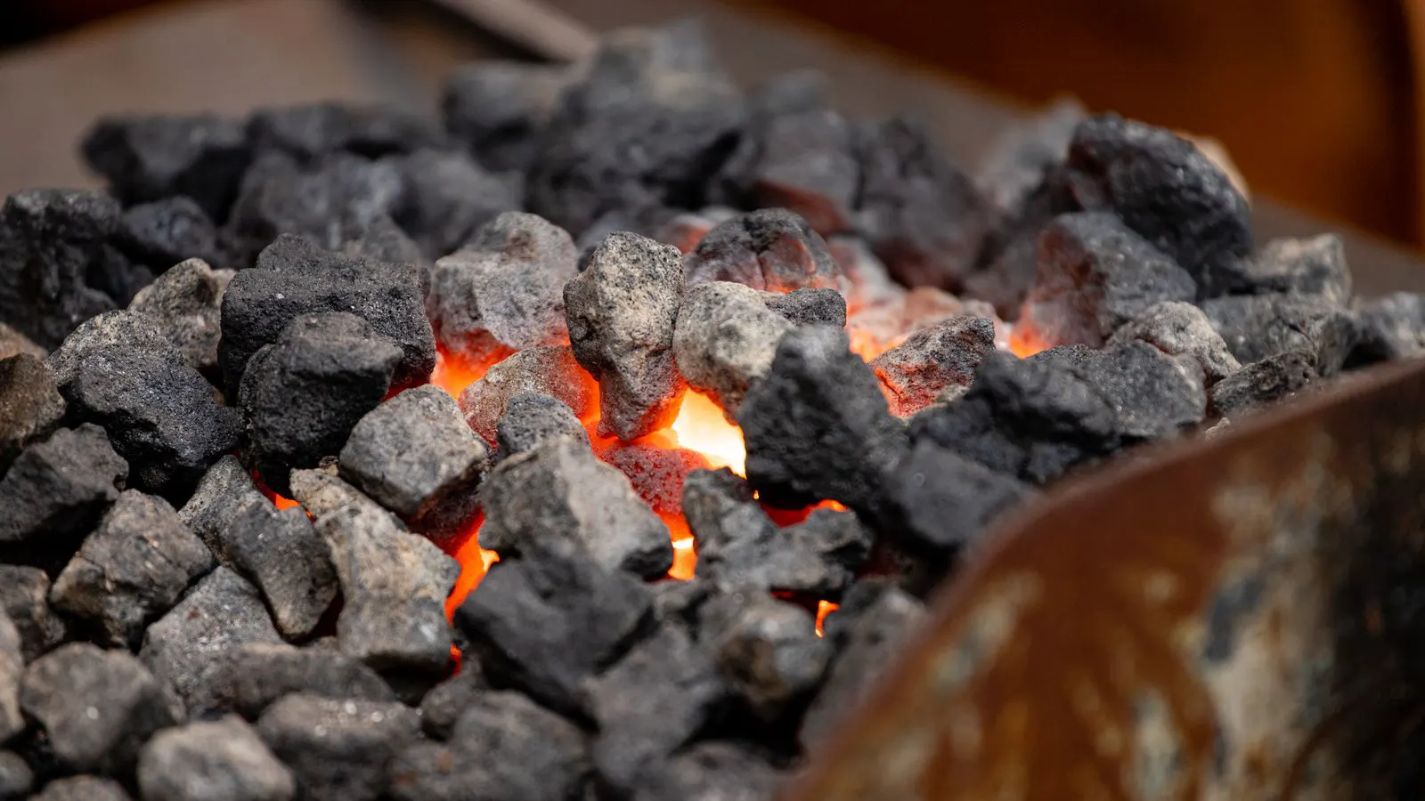 Industrial furnace with glowing metal parts inside