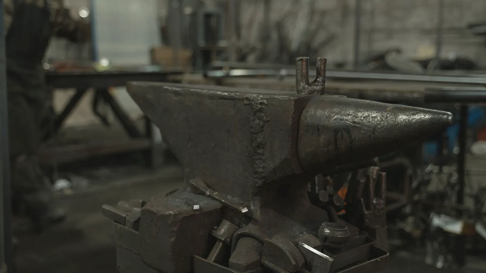 Aluminum and titanium forged metal components displayed side by side.